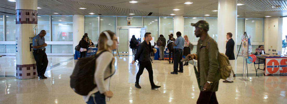 students walking in BMCC lobby