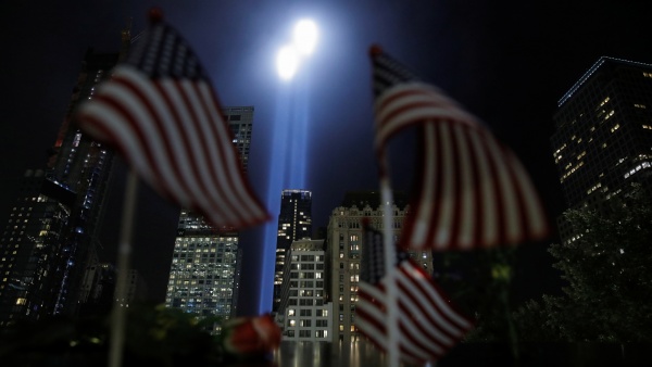 image of NYC skyline with candles representing Twin Towers