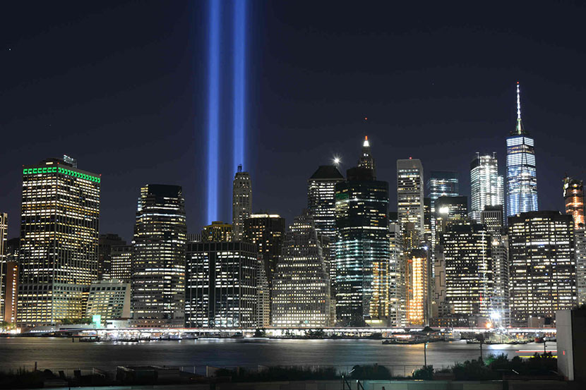 Manhattan skyline with blue beams commemorating 9/11