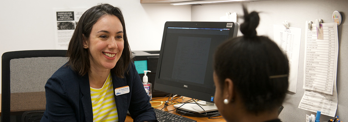 counselor speaking with student in office