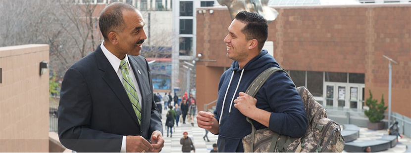 Wilfred Cotto of the Veterans Resource Center speaking to a student