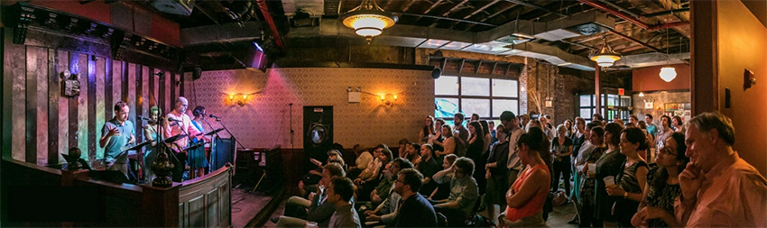 audience of people listening to speakers