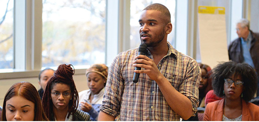 student speaking in class