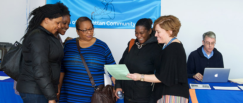 several people looking at handouts