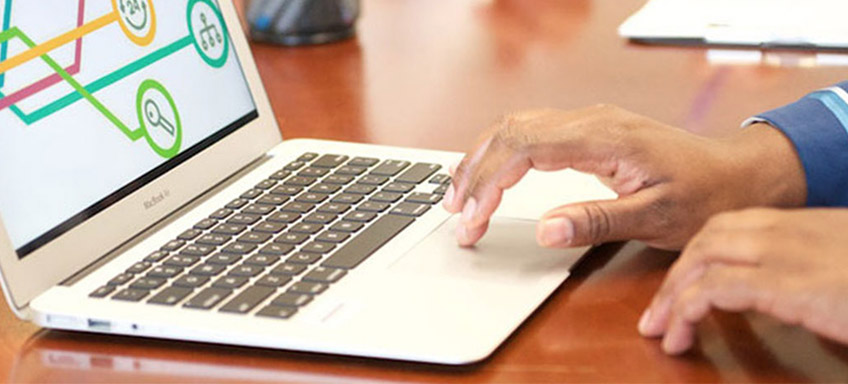 laptop computer and the hands of a person using it