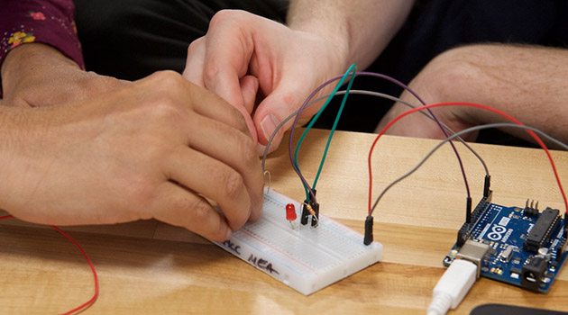 people working on circuit boards