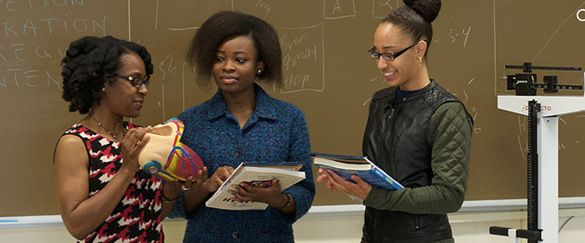 three people presenting health information in a classroom