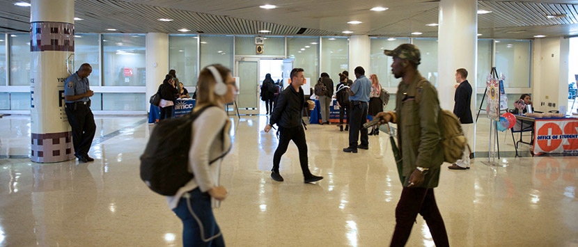 students walking through Chambers St. building