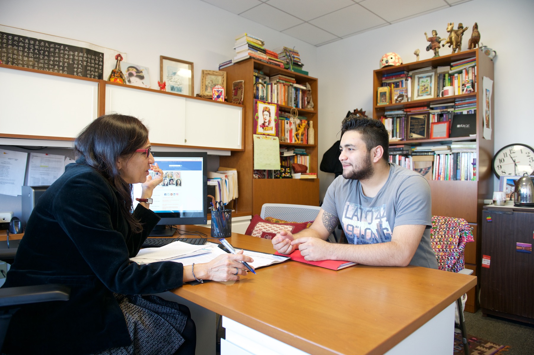 Professor and Department Chair Patricia Mathews with work study student in Ethnic and Race Studies Department office.