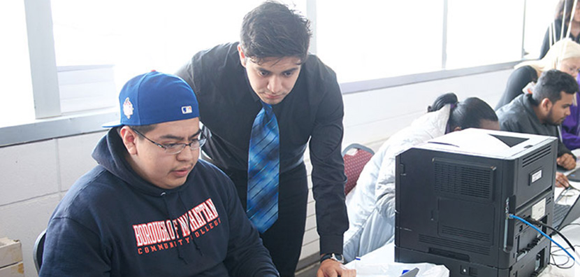 staff member helping student with financial aid