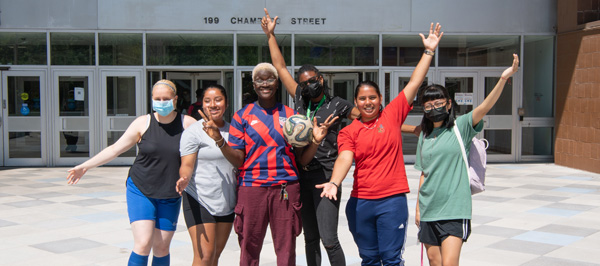 students in front of college building