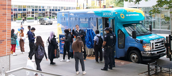 mobile vaccination van in front of Fiterman Hall